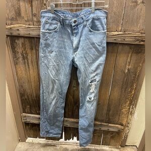Men's Distressed Wrangler Blue Jeans